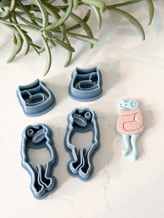 1.5 inch frog and sweater clay cutter set with polymer cutter tools and a finished frog figure in pink sweater